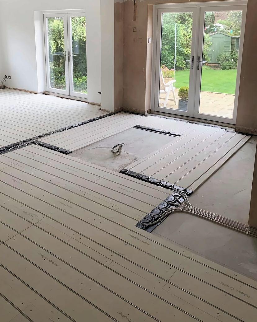 Underfloor heating pipework laid in boards across an extension floor